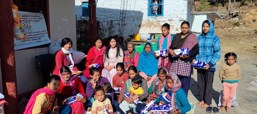 Mrs Misra distributing pads